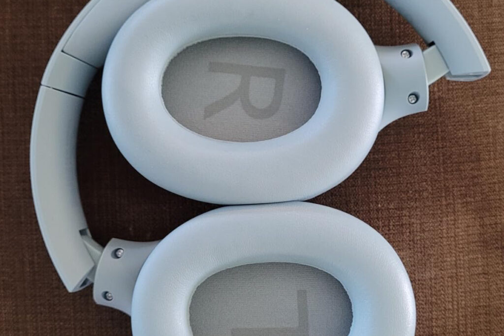 White tozo ht2 headphones